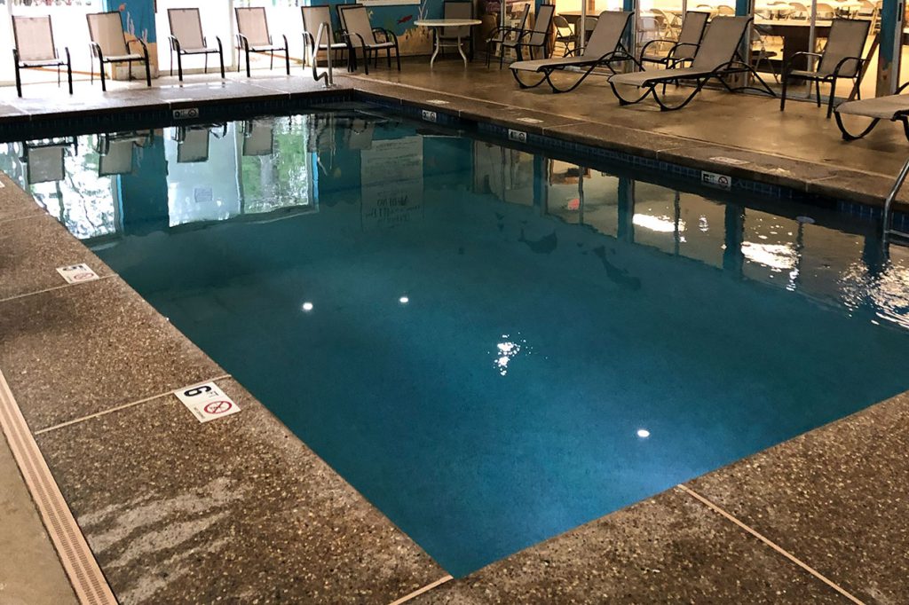 indoor commercial pool adobe exposed aggregate deck