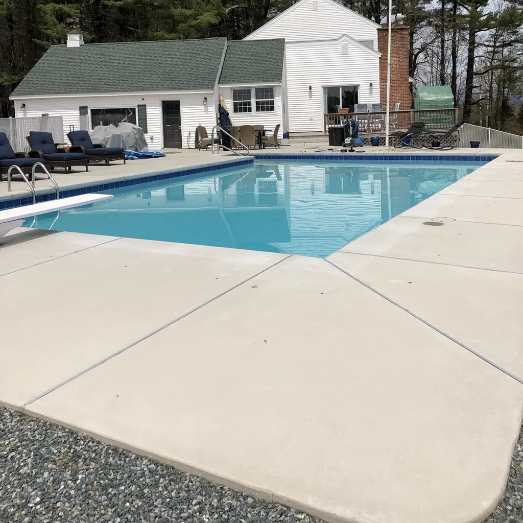 pool with plain gray concrete deck